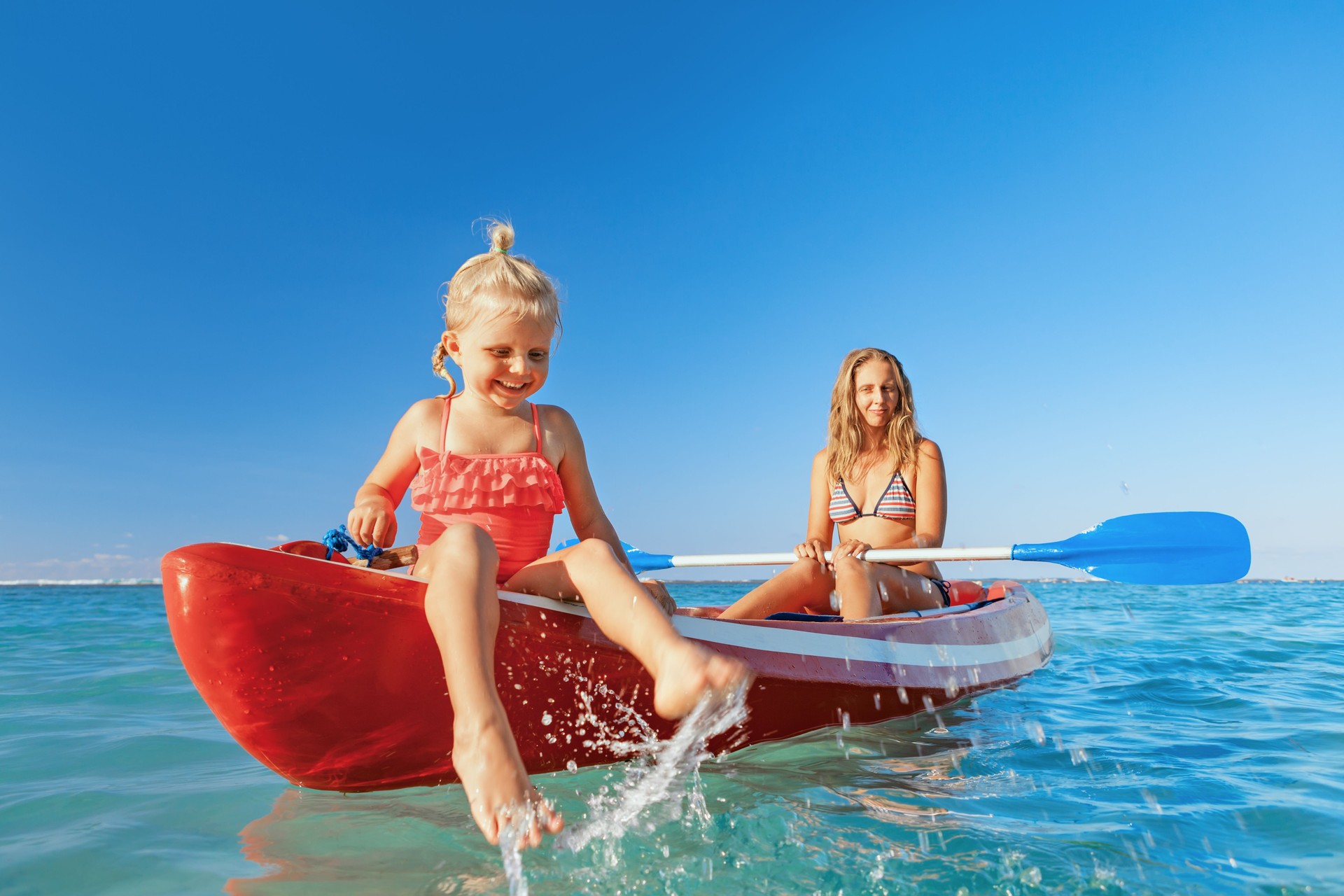 Happy family - young mother, children have fun on boat walk